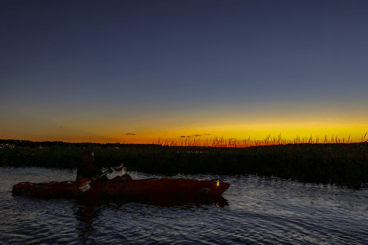 a sunset over a body of water