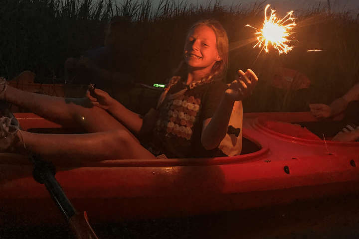 a person sitting in front of a fire