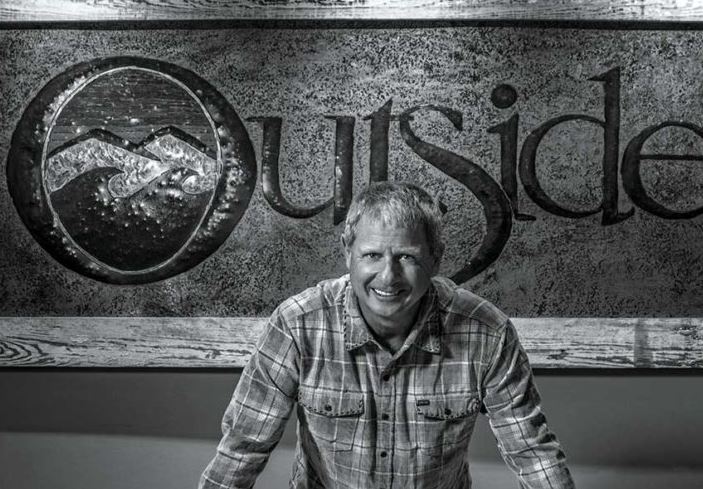 mike-overton-local-life man in front of outside logo
