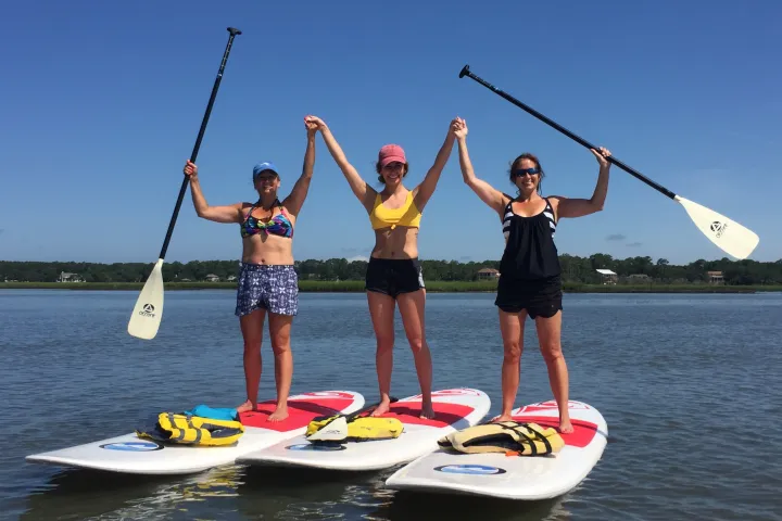 a group of people on a boat in the water