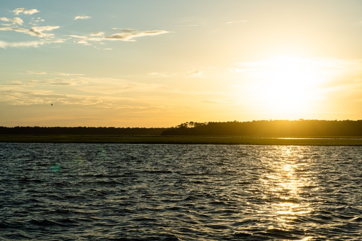 a sunset over a body of water