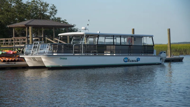a boat is docked next to a body of water