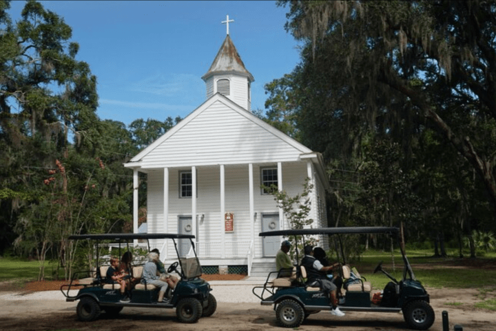a group of people riding on the back of a truck