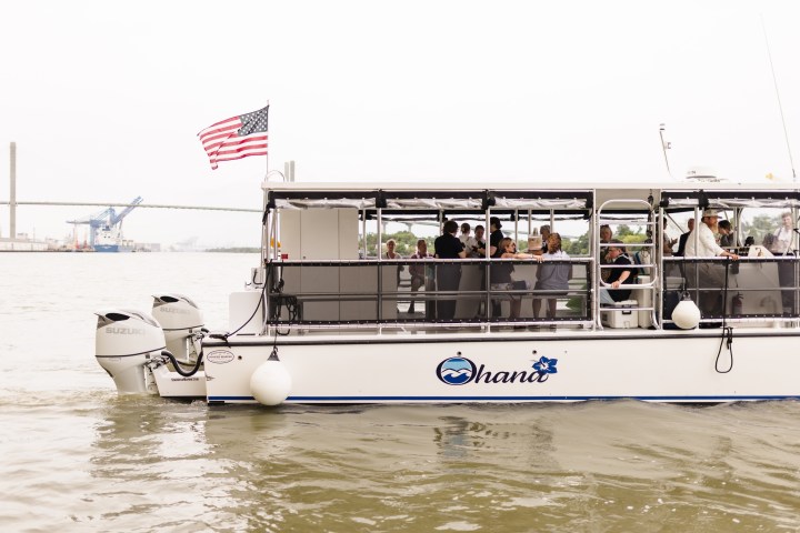a group of people on a boat in the water